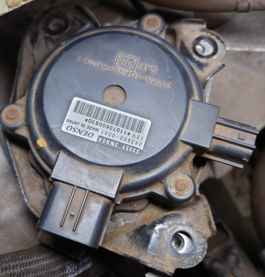 Nissan EM61 P-brake actuator assembly.