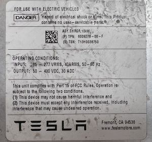 Tesla GEN1 OBC label, showing part No. and input/output specs. These are not to be relied upon.